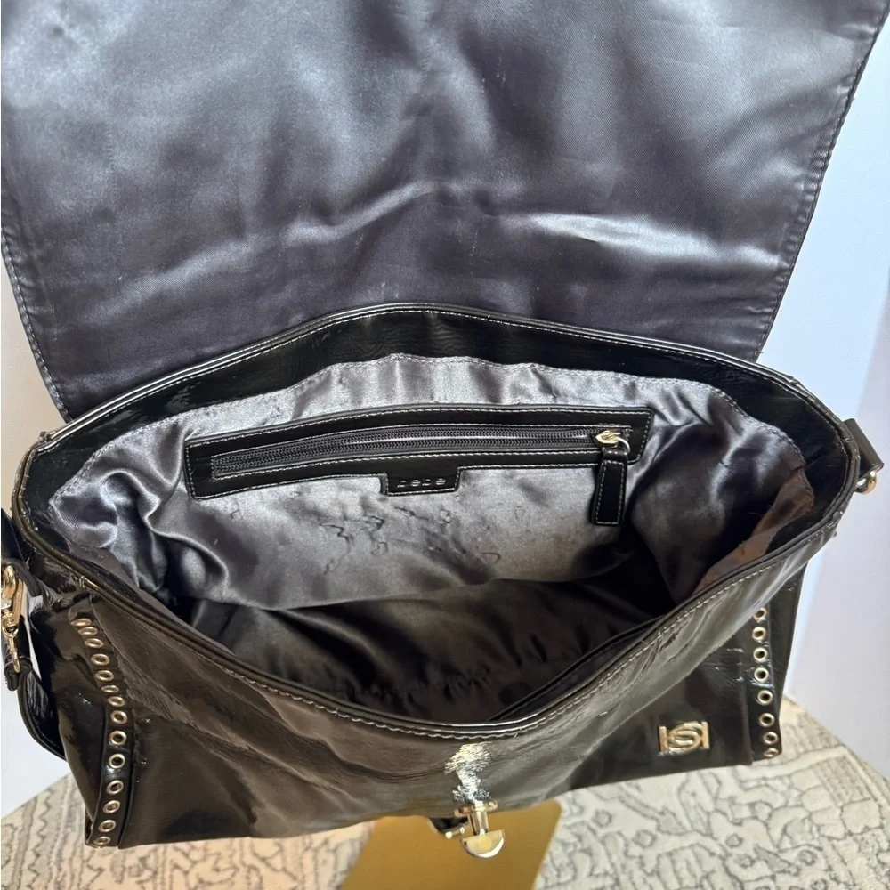 BEBE Large Handbag Leopard Grommet in Black and gray and gold